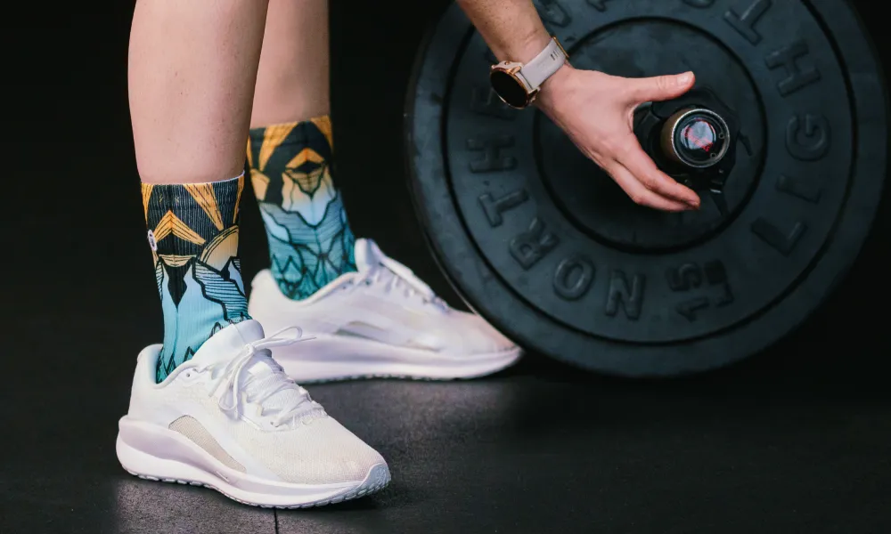 Person at the gym wearing OUTWAY athletic crew socks