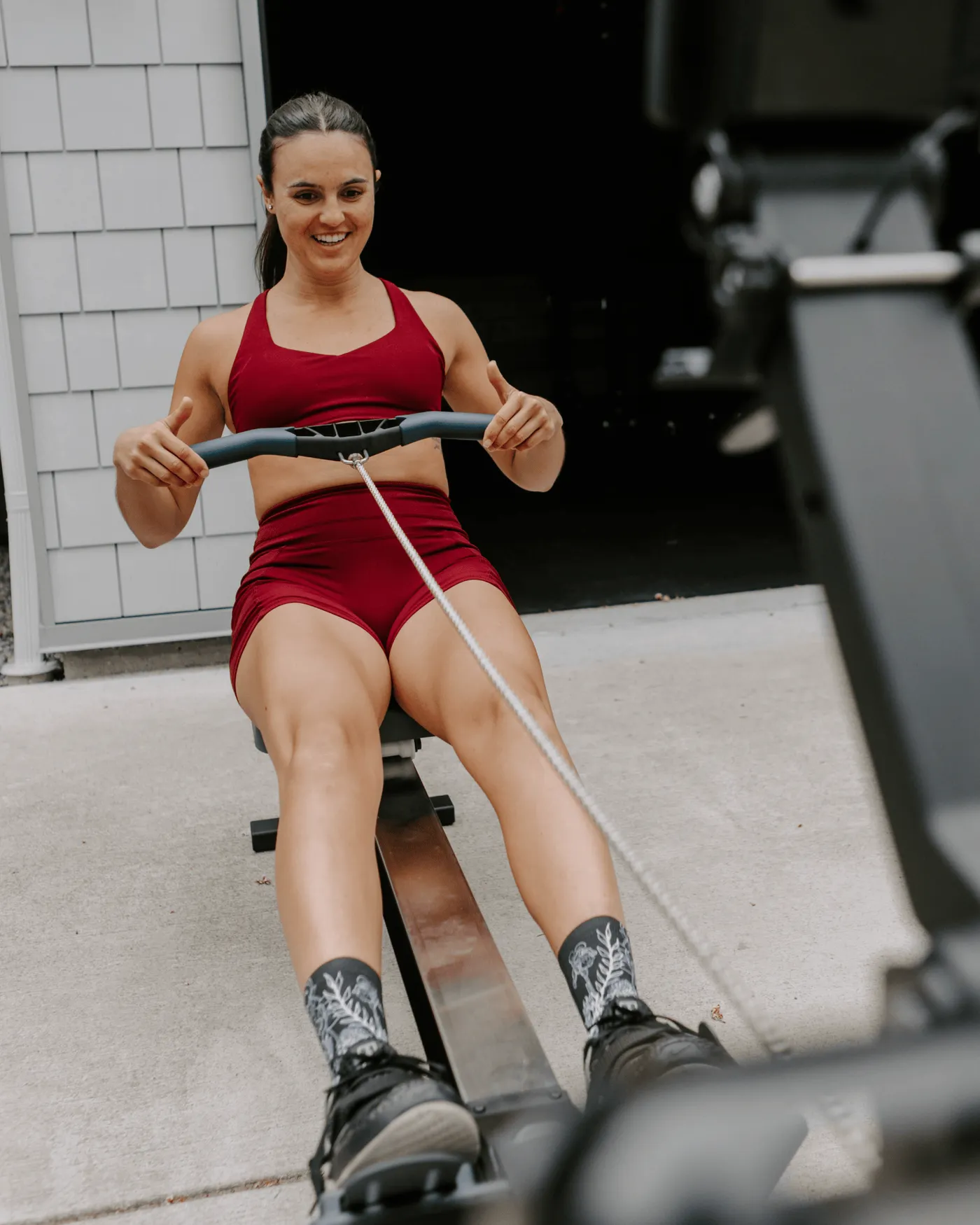 Athlete on a rowing machine in Outway socks