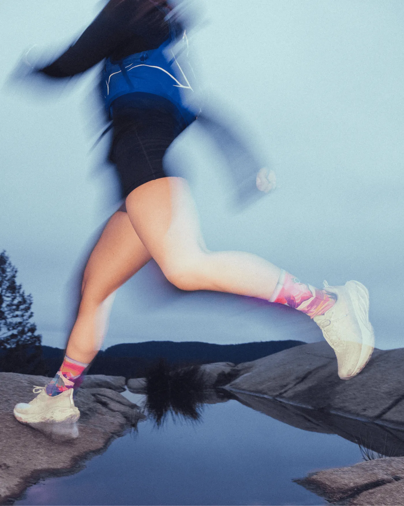 Runner mid-stride in Outway socks