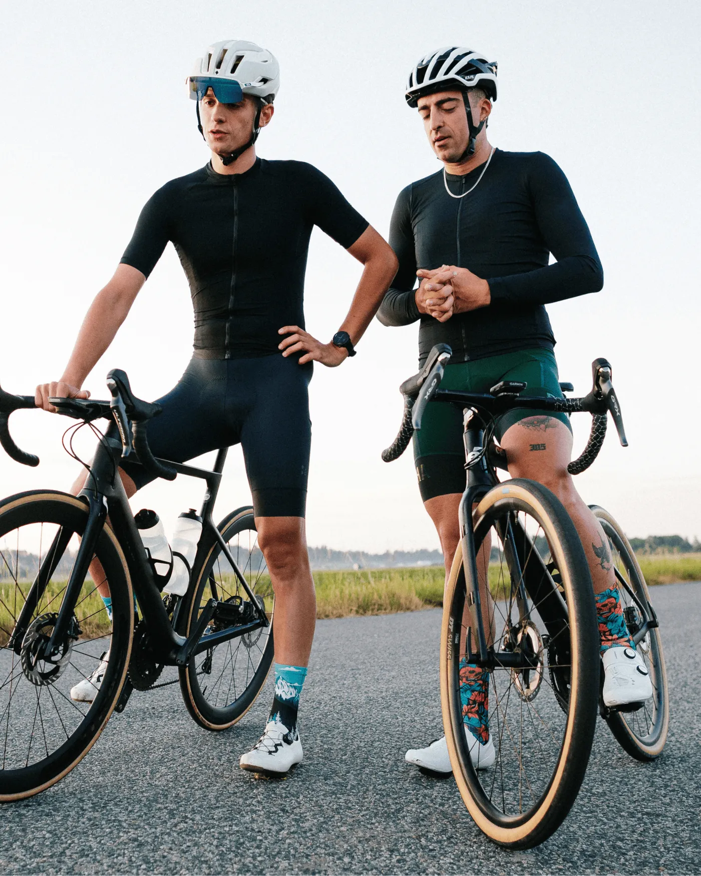 Two cyclists with their bikes in Outway socks