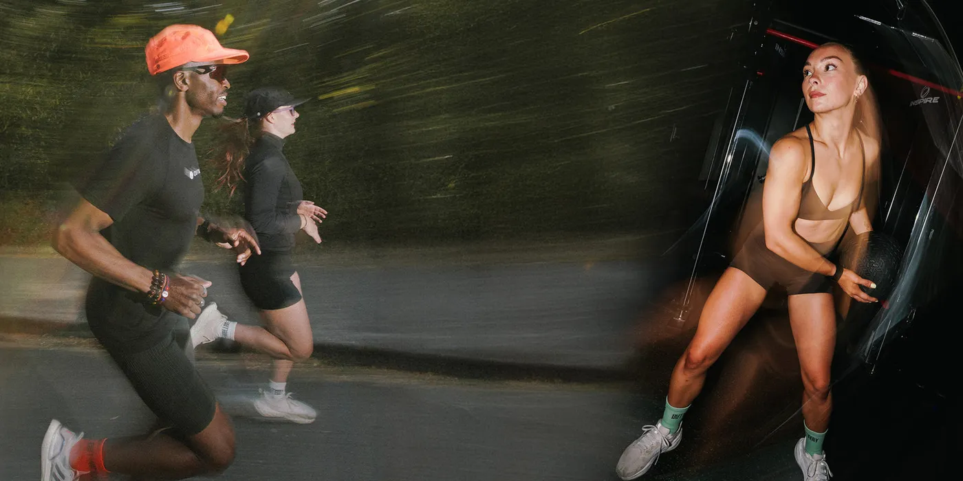 Two runners mid-stride on a city street at dusk